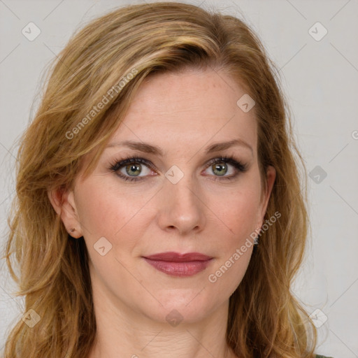 Joyful white young-adult female with long  brown hair and green eyes