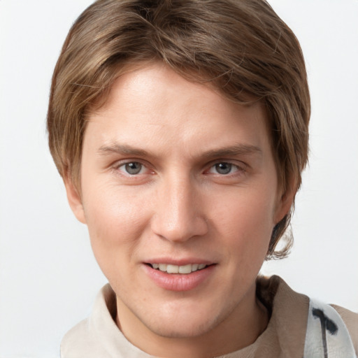 Joyful white young-adult female with short  brown hair and grey eyes