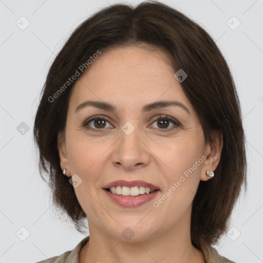 Joyful white adult female with medium  brown hair and brown eyes