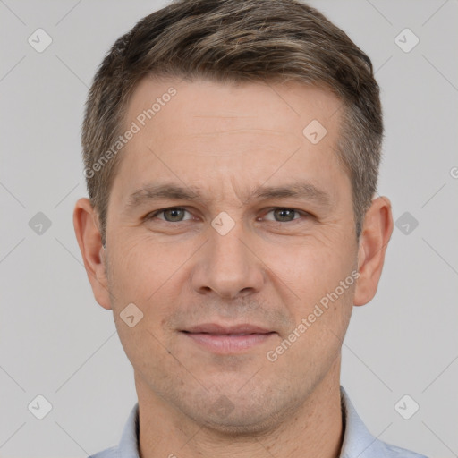 Joyful white adult male with short  brown hair and brown eyes