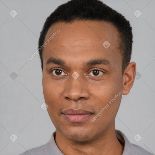 Joyful latino adult male with short  black hair and brown eyes
