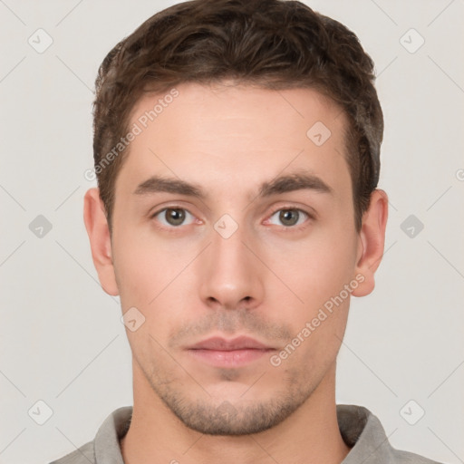 Neutral white young-adult male with short  brown hair and brown eyes