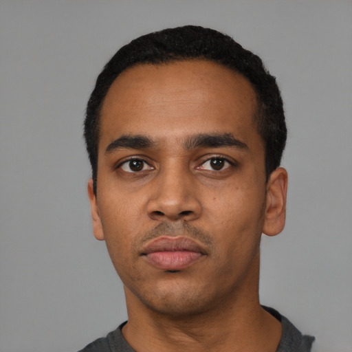 Neutral black young-adult male with short  black hair and brown eyes