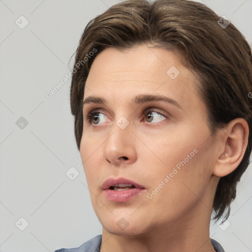 Neutral white young-adult female with medium  brown hair and brown eyes