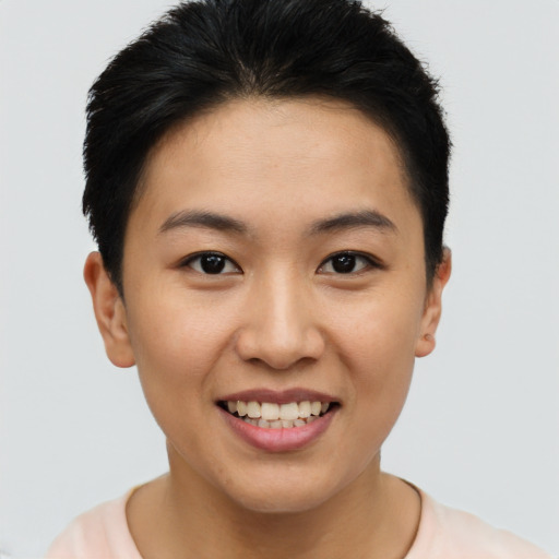 Joyful asian young-adult female with short  brown hair and brown eyes