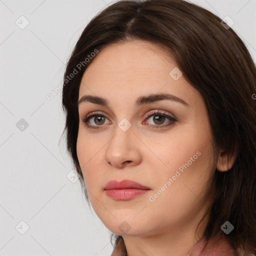 Joyful white young-adult female with long  brown hair and green eyes