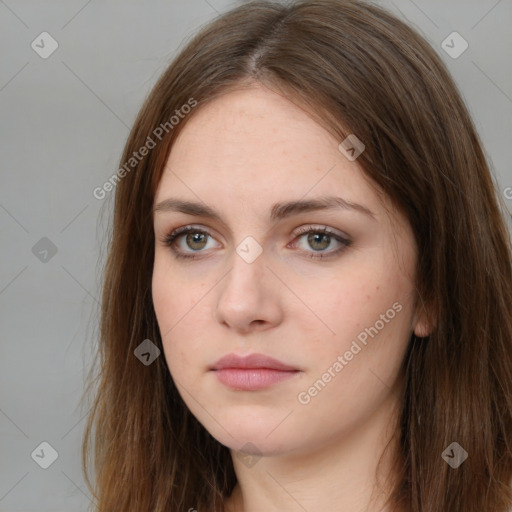 Neutral white young-adult female with long  brown hair and brown eyes