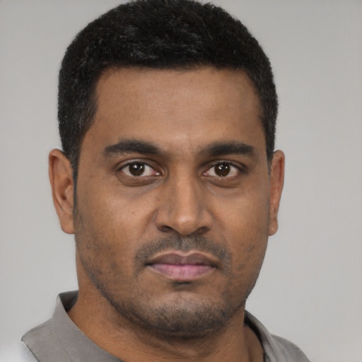 Neutral black young-adult male with short  brown hair and brown eyes