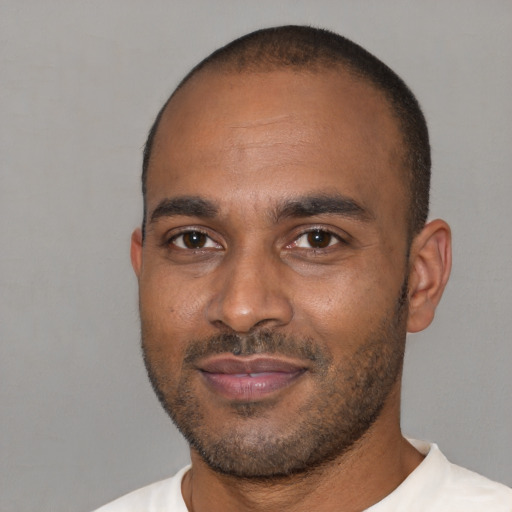 Joyful latino adult male with short  black hair and brown eyes