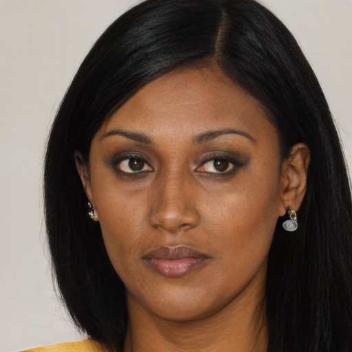 Neutral black young-adult female with long  black hair and brown eyes