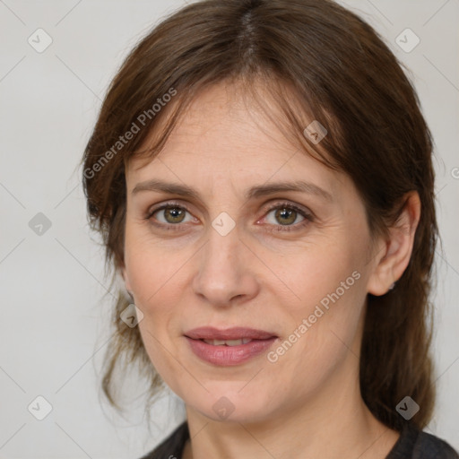 Joyful white adult female with medium  brown hair and grey eyes