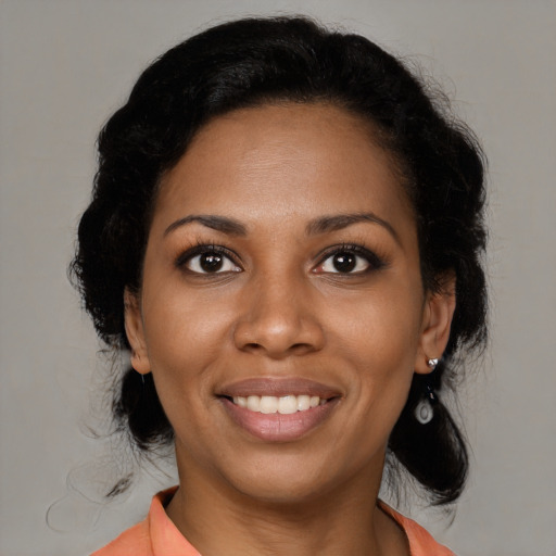 Joyful black young-adult female with medium  black hair and brown eyes