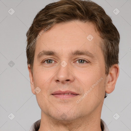 Joyful white adult male with short  brown hair and brown eyes