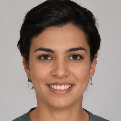 Joyful white young-adult female with short  brown hair and brown eyes