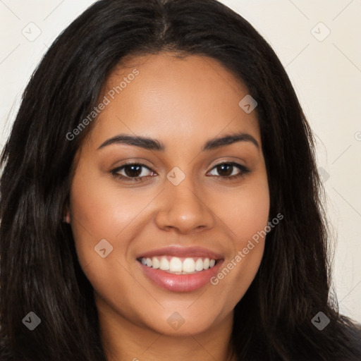 Joyful latino young-adult female with long  brown hair and brown eyes