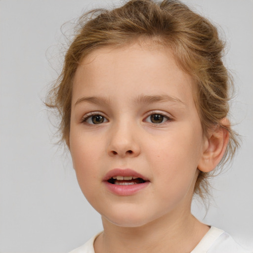 Joyful white child female with medium  brown hair and brown eyes