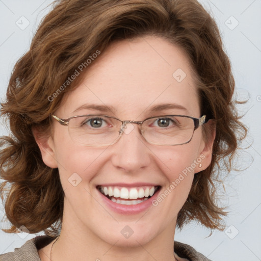 Joyful white adult female with medium  brown hair and blue eyes