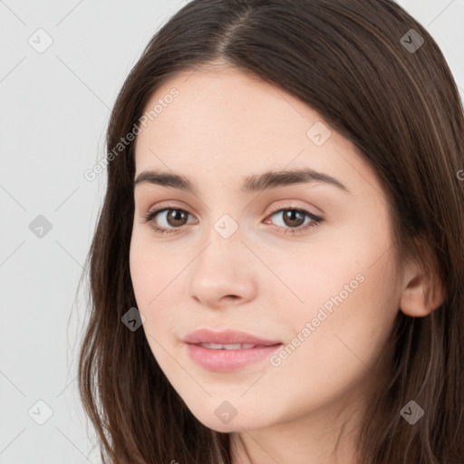 Neutral white young-adult female with long  brown hair and brown eyes