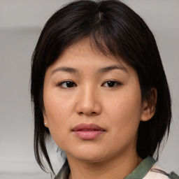 Neutral asian young-adult female with medium  brown hair and brown eyes