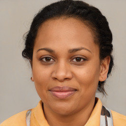 Joyful latino adult female with medium  brown hair and brown eyes