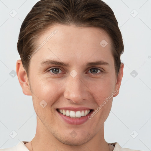 Joyful white young-adult female with short  brown hair and grey eyes