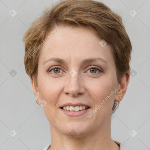 Joyful white adult female with short  brown hair and grey eyes