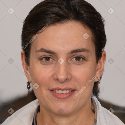 Joyful white adult female with short  brown hair and brown eyes