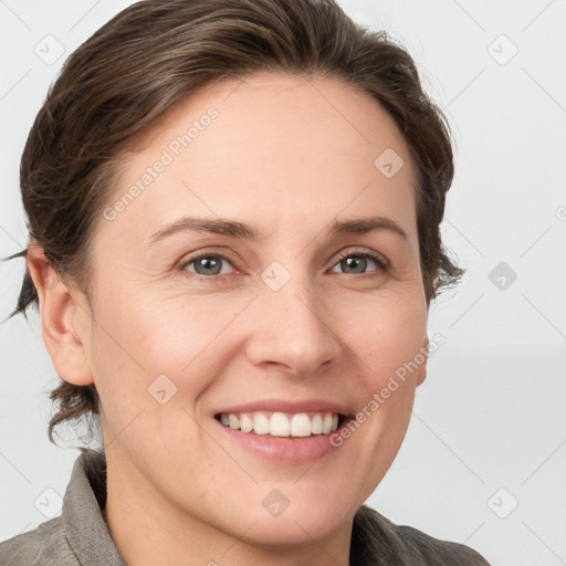 Joyful white young-adult female with medium  brown hair and grey eyes