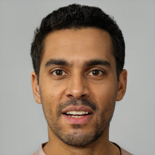 Neutral latino young-adult male with short  black hair and brown eyes