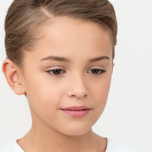 Joyful white child female with short  brown hair and brown eyes