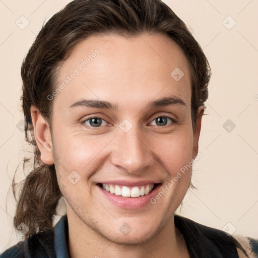 Joyful white young-adult female with medium  brown hair and grey eyes