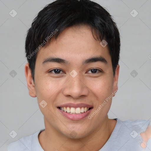 Joyful asian young-adult male with short  brown hair and brown eyes