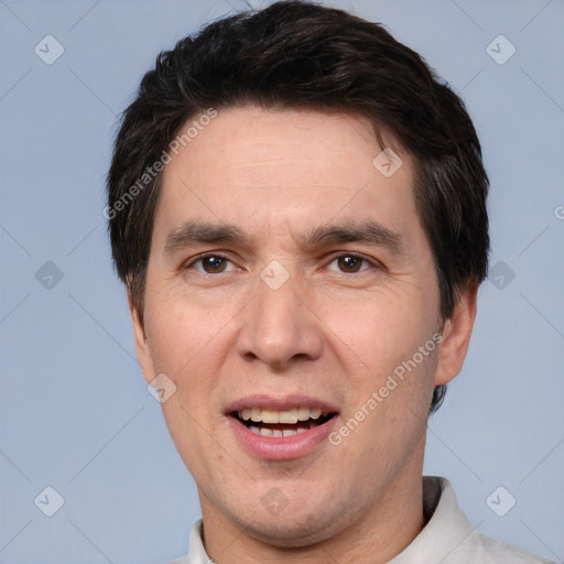 Joyful white adult male with short  brown hair and brown eyes