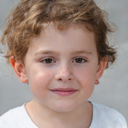 Joyful white child male with short  brown hair and brown eyes