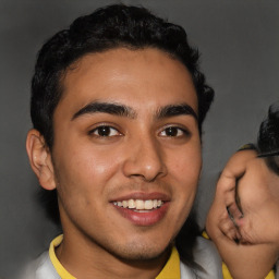 Joyful latino young-adult male with short  brown hair and brown eyes