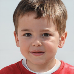 Joyful white child male with short  brown hair and brown eyes