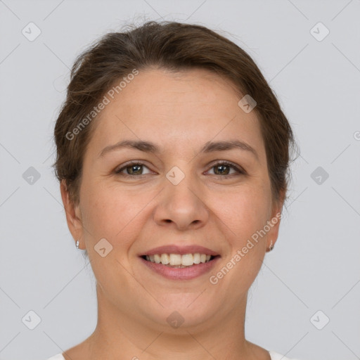 Joyful white adult female with short  brown hair and grey eyes