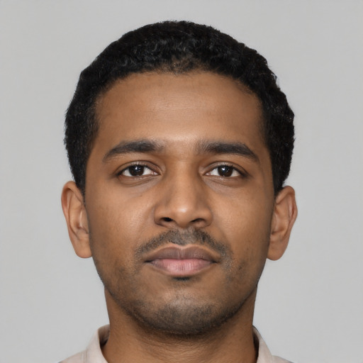 Neutral black young-adult male with short  black hair and brown eyes