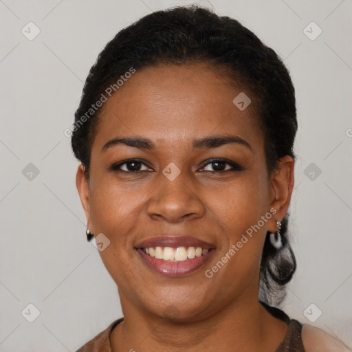 Joyful latino young-adult female with short  black hair and brown eyes