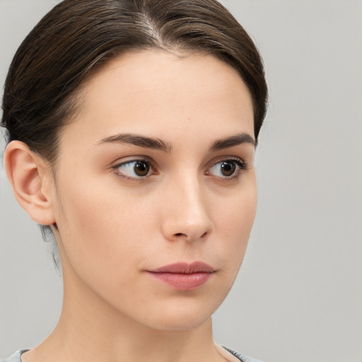 Neutral white young-adult female with medium  brown hair and brown eyes