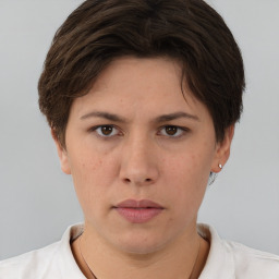 Neutral white young-adult female with short  brown hair and brown eyes