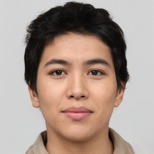 Joyful asian young-adult male with short  brown hair and brown eyes