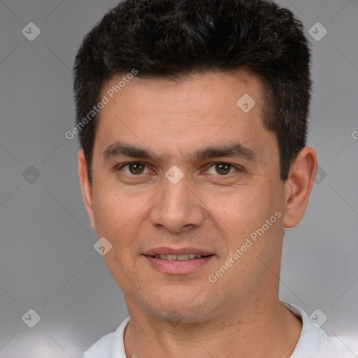 Joyful white young-adult male with short  black hair and brown eyes