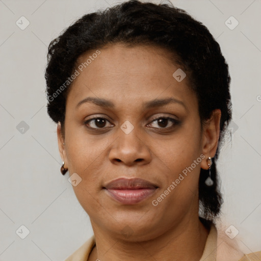 Joyful black adult female with short  brown hair and brown eyes