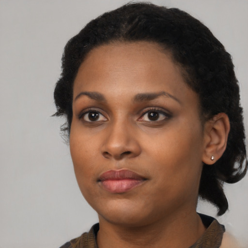 Neutral black young-adult female with medium  black hair and brown eyes