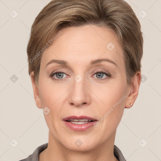 Joyful white adult female with short  brown hair and grey eyes