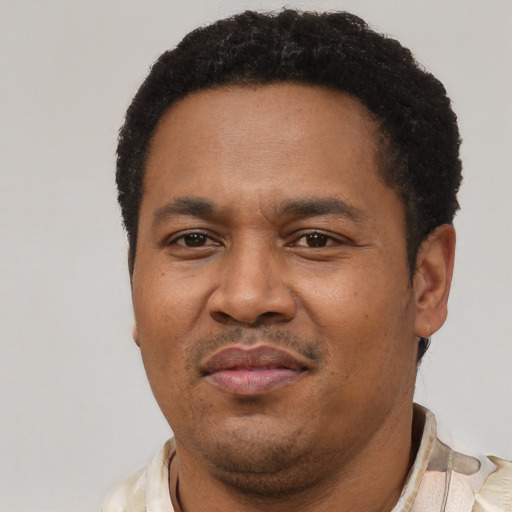 Neutral latino adult male with short  black hair and brown eyes