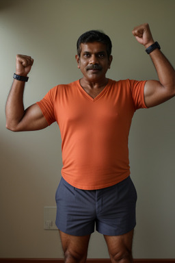 Sri lankan middle-aged male with  ginger hair