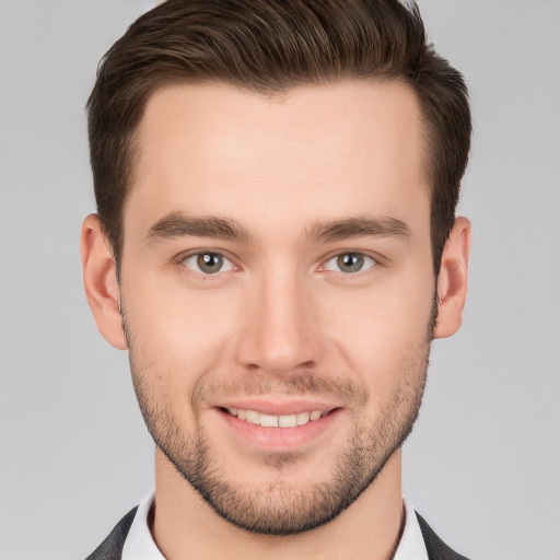 Joyful white young-adult male with short  brown hair and brown eyes