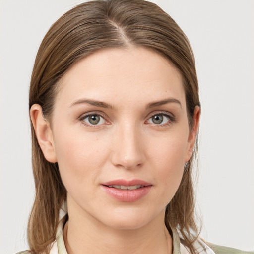 Joyful white young-adult female with medium  brown hair and grey eyes